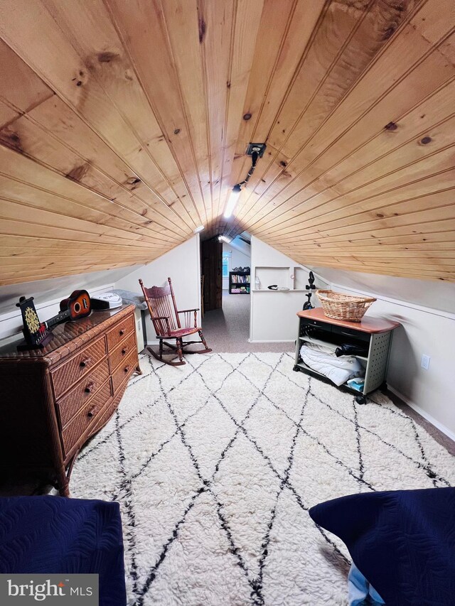 interior space with wooden ceiling, vaulted ceiling, and light carpet