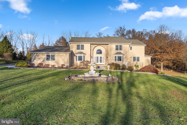 view of front of home featuring a front lawn