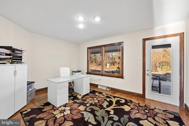 office featuring plenty of natural light and light hardwood / wood-style floors