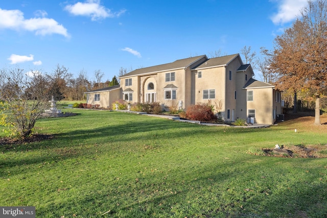 view of front of house with a front lawn