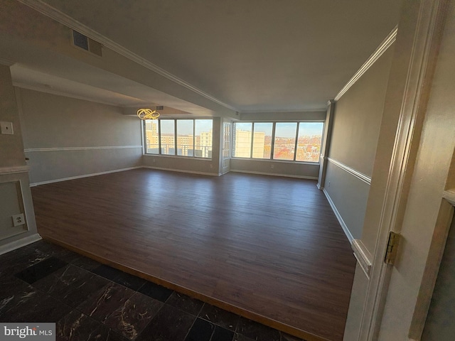 interior space featuring dark wood-type flooring and ornamental molding