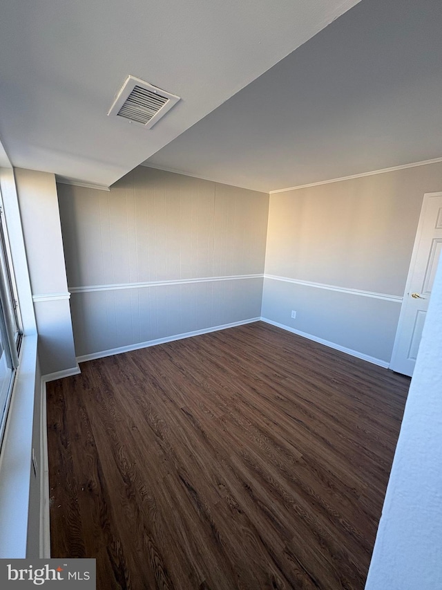 spare room with dark wood-type flooring