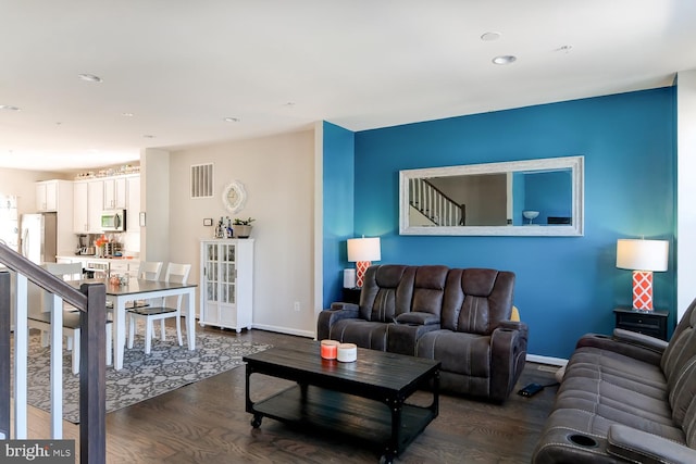 living room featuring dark hardwood / wood-style flooring