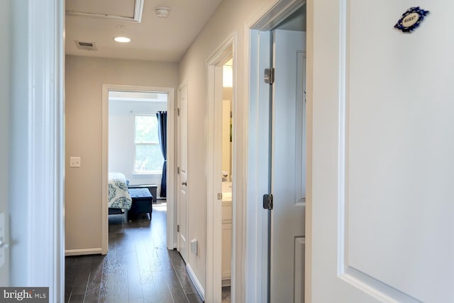 hallway with dark wood-type flooring