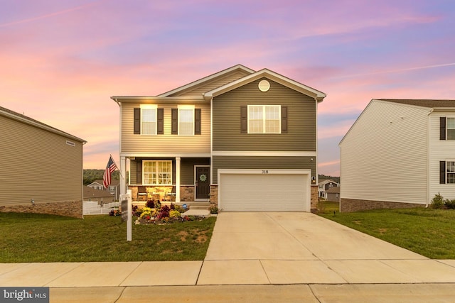 view of property featuring a lawn and a garage