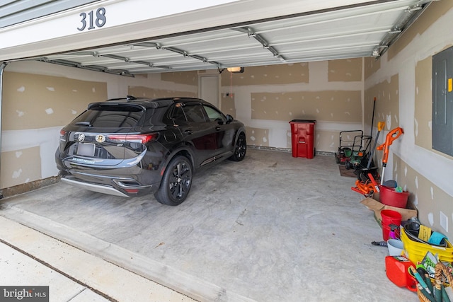 garage featuring a garage door opener and electric panel