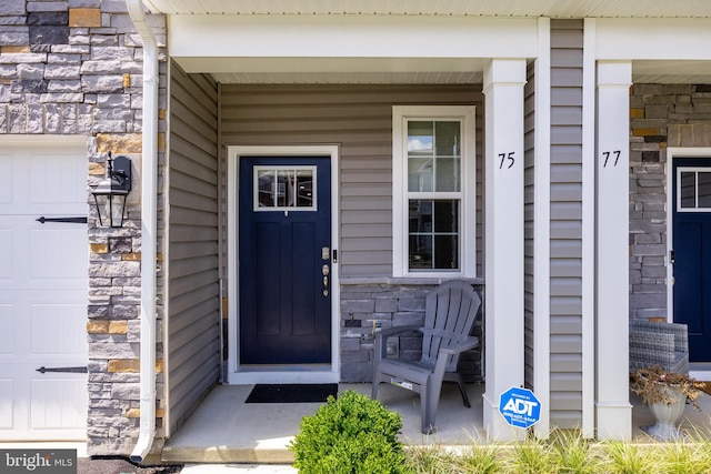 property entrance with a garage