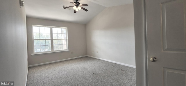 carpeted empty room with ceiling fan and vaulted ceiling