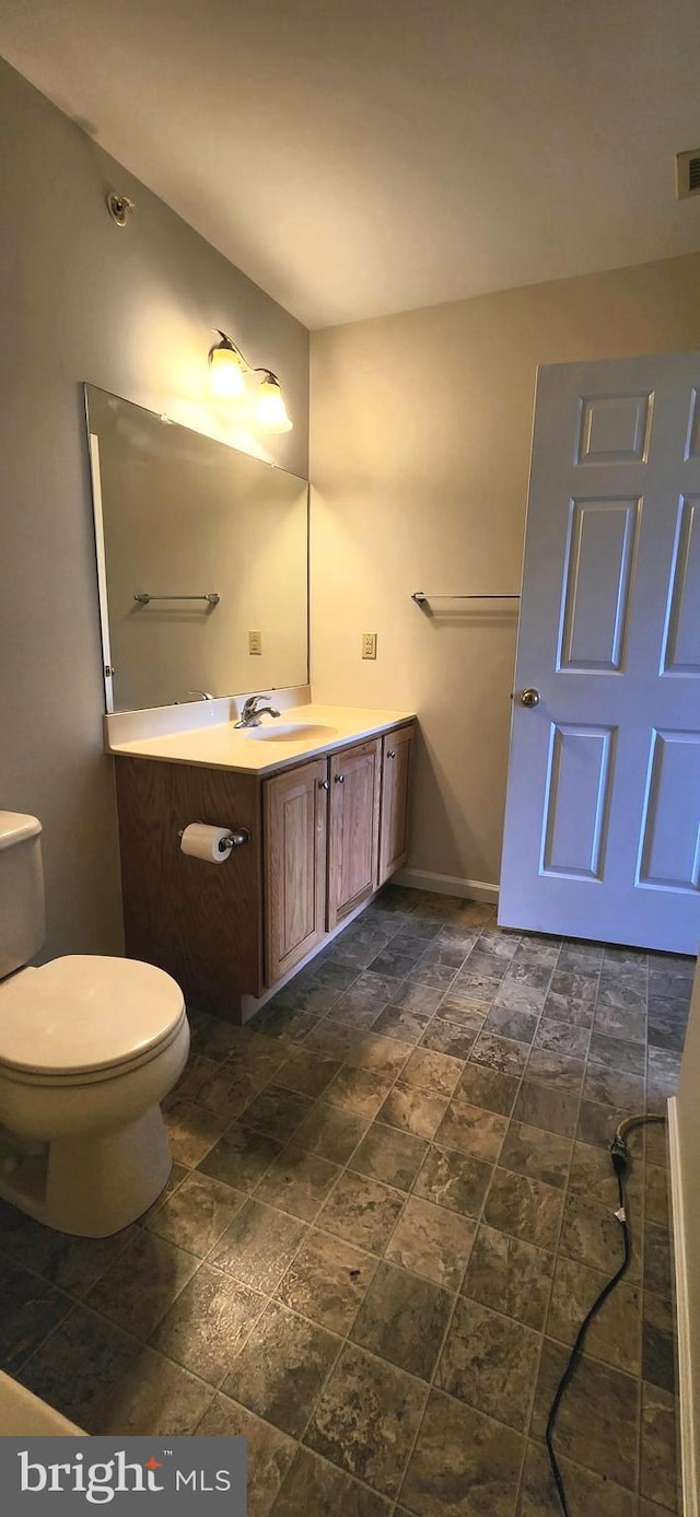 bathroom with vanity and toilet