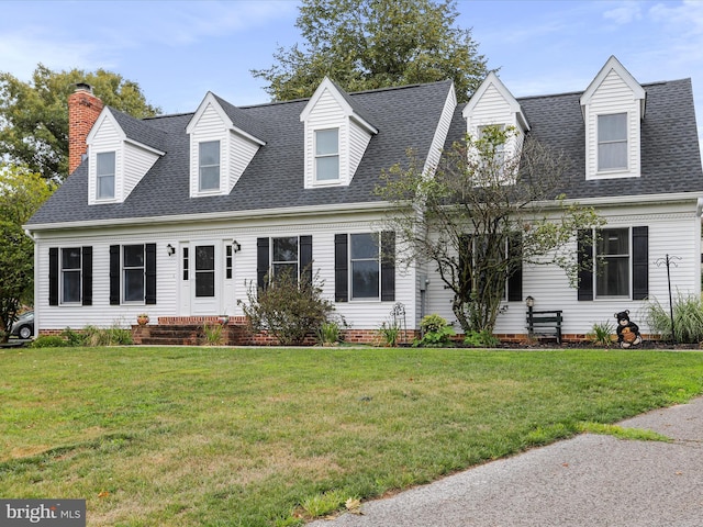 new england style home with a front yard