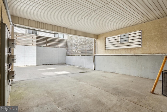 unfurnished bedroom with ensuite bath, light hardwood / wood-style flooring, and a closet