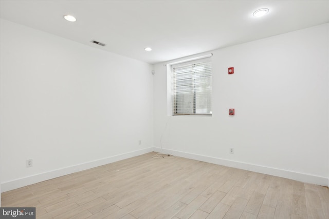 spare room with light wood-type flooring