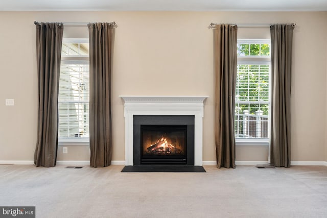 unfurnished living room featuring carpet floors