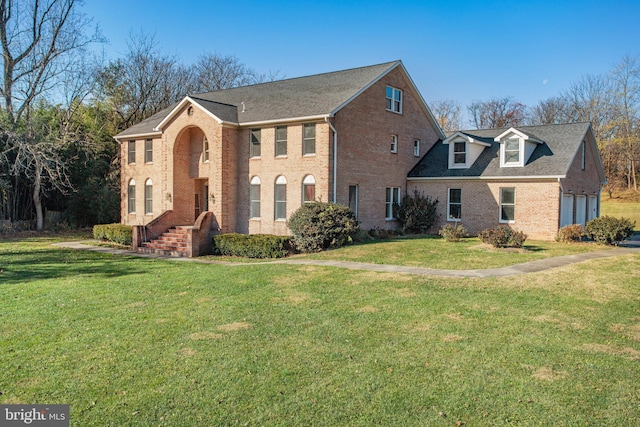 view of front of property with a front lawn