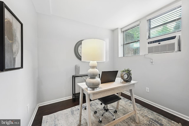 office with cooling unit and dark wood-type flooring