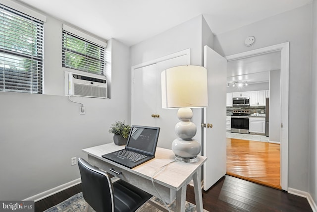 office with cooling unit and dark wood-type flooring