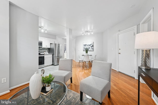 living room with light hardwood / wood-style flooring