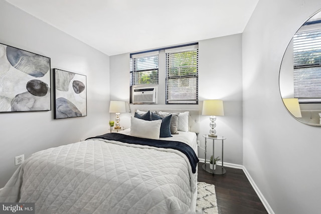 bedroom featuring cooling unit and dark hardwood / wood-style floors