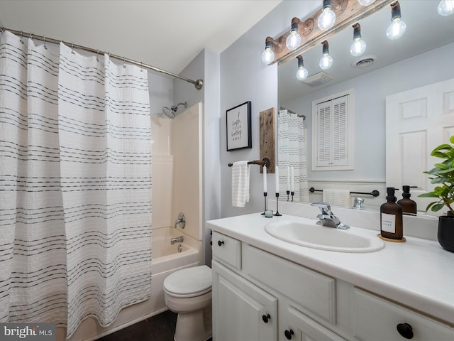 full bath with tile patterned floors, visible vents, shower / tub combo with curtain, toilet, and vanity