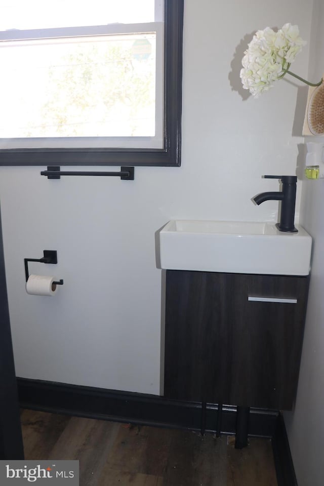 bathroom with sink and hardwood / wood-style floors