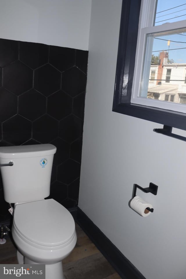 bathroom featuring toilet and hardwood / wood-style flooring