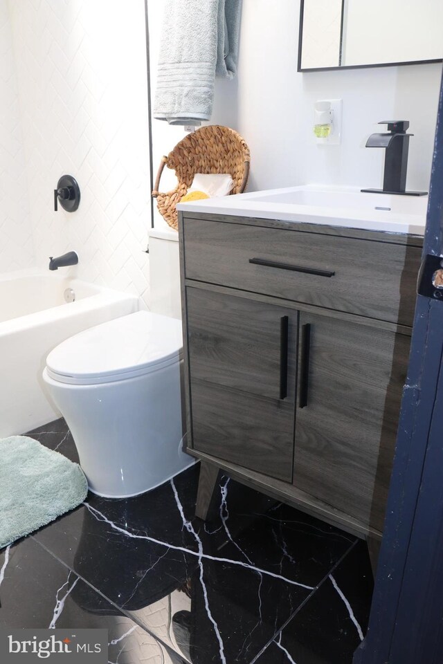 bathroom with toilet and vanity