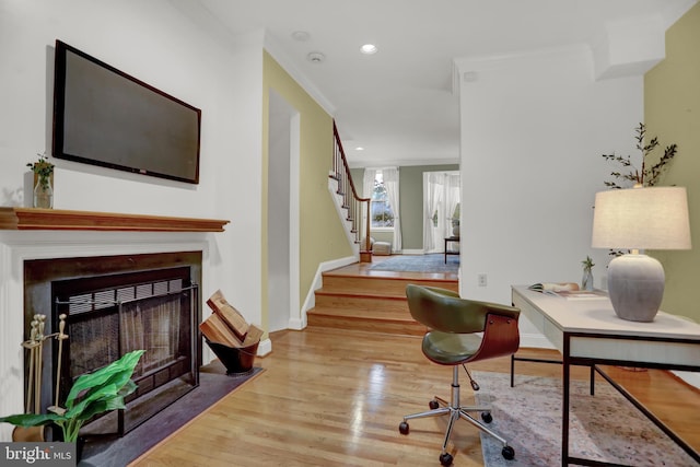 office featuring hardwood / wood-style flooring and ornamental molding