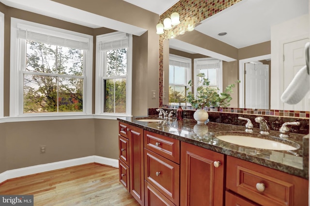 bathroom with vanity and hardwood / wood-style flooring