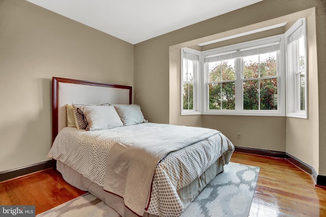 bedroom with light hardwood / wood-style floors