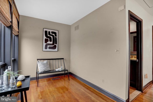 sitting room with hardwood / wood-style floors