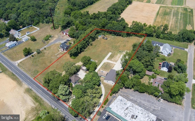 birds eye view of property featuring a rural view