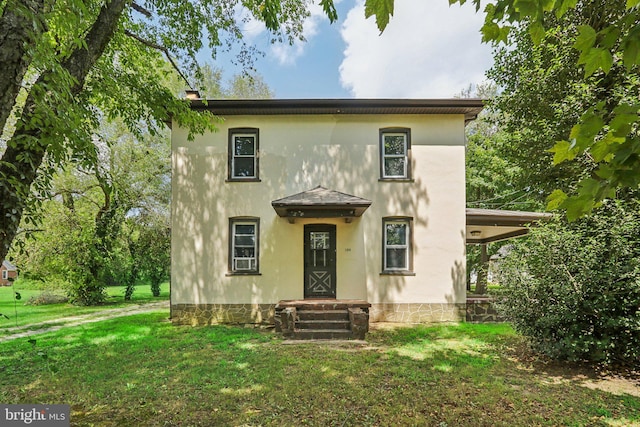 mediterranean / spanish house with a front lawn