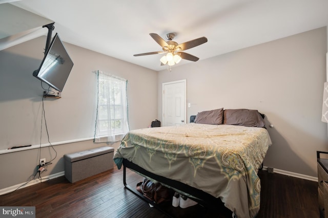 bedroom featuring ceiling fan and dark hardwood / wood-style floors