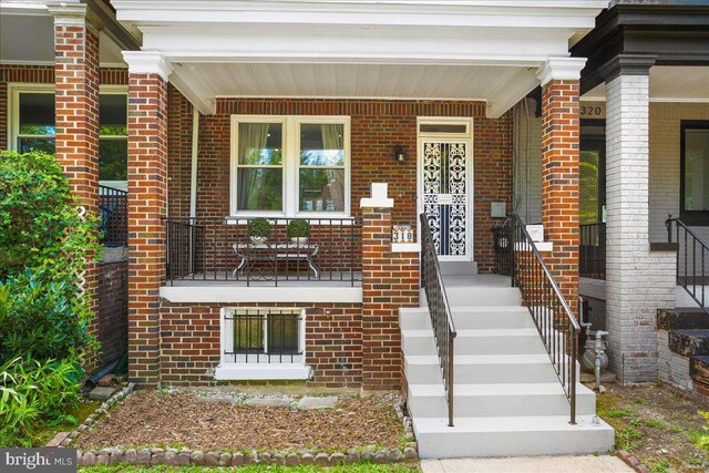 entrance to property with covered porch