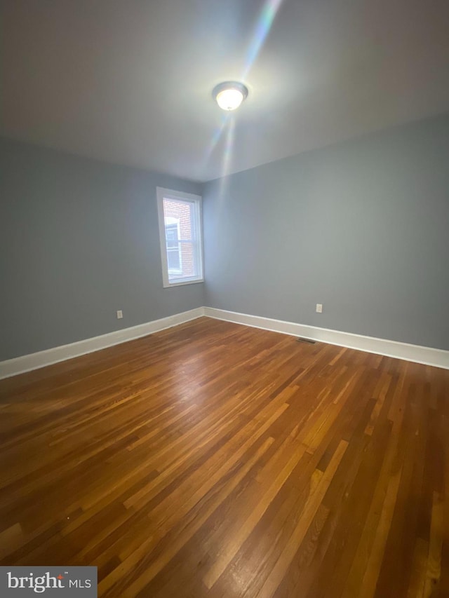 empty room featuring hardwood / wood-style floors