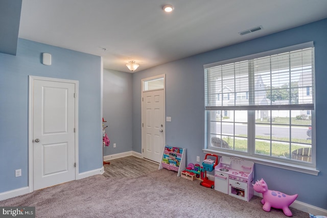 playroom featuring light carpet