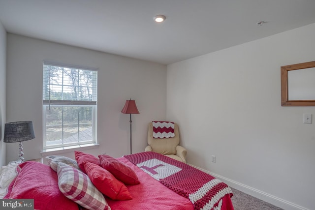 bedroom featuring carpet flooring and multiple windows