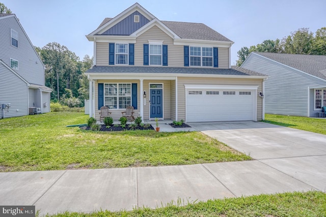 view of front of home with a garage and a front yard