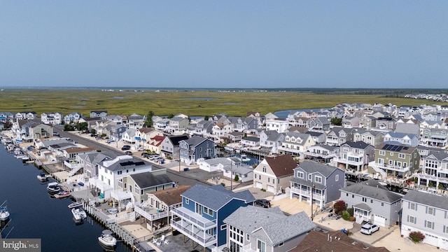 bird's eye view featuring a water view and a residential view