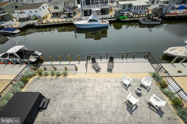 drone / aerial view with a residential view and a water view