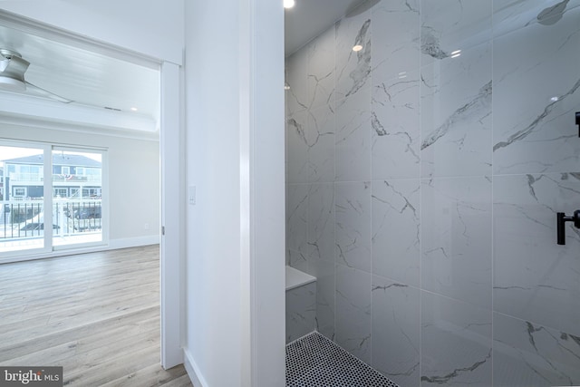 bathroom with baseboards, wood finished floors, a marble finish shower, and recessed lighting