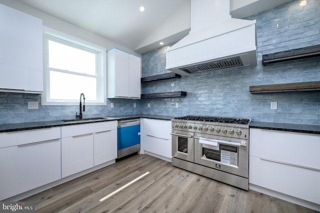 kitchen featuring open shelves, custom exhaust hood, white cabinetry, and stainless steel appliances