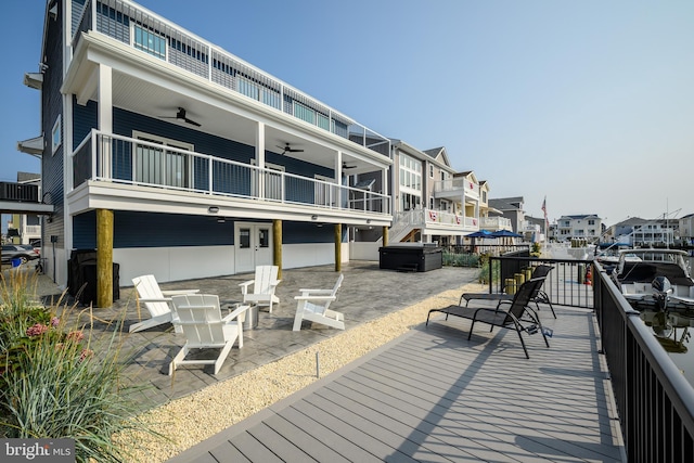 exterior space with a residential view, a patio area, and ceiling fan