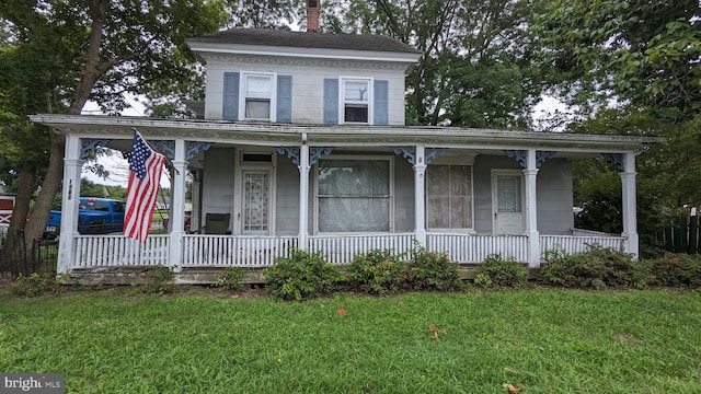 view of front of home with a front lawn and a porch