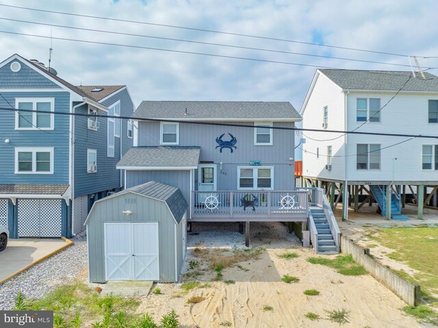 exterior space with a storage shed and a deck