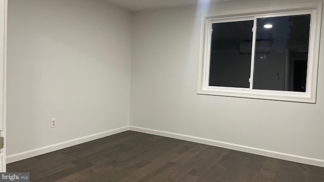 empty room with wood-type flooring