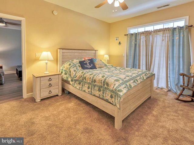 bedroom featuring ceiling fan and carpet floors