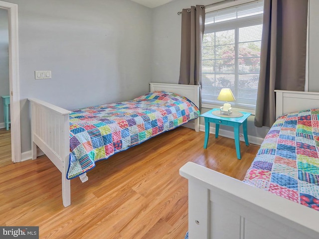 bedroom featuring hardwood / wood-style flooring