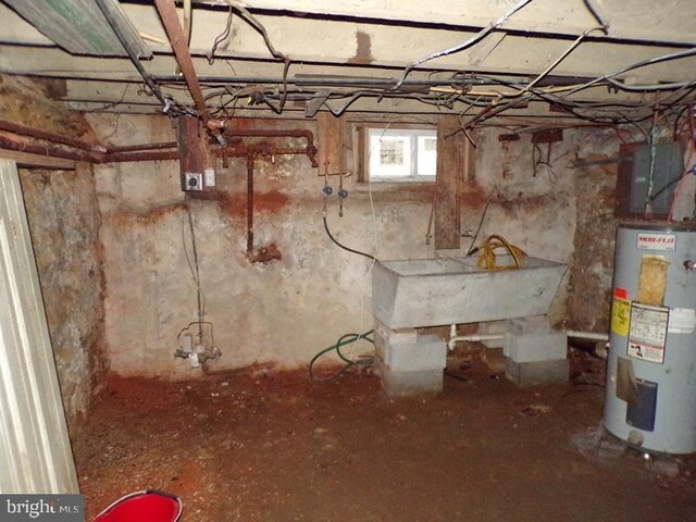 basement featuring sink and gas water heater