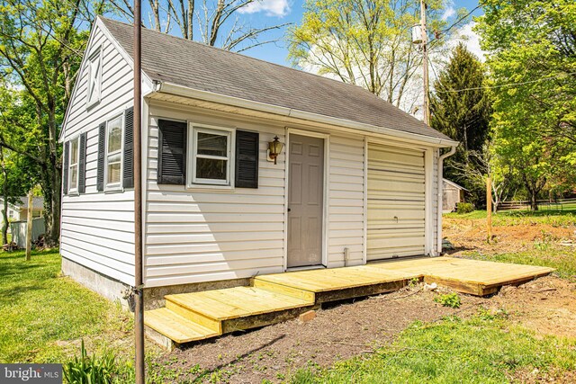 view of outdoor structure with a lawn